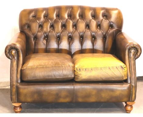 Brown leather buttoned back Chesterfield style sofa on tulip feet, 125 x 75. Not available for in-house P&amp;P, contact Paul