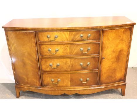 Bevan Funnel Reprodux mahogany sideboard of four drawers flanked by two cupboards, bow-fronted and raised on bracket supports