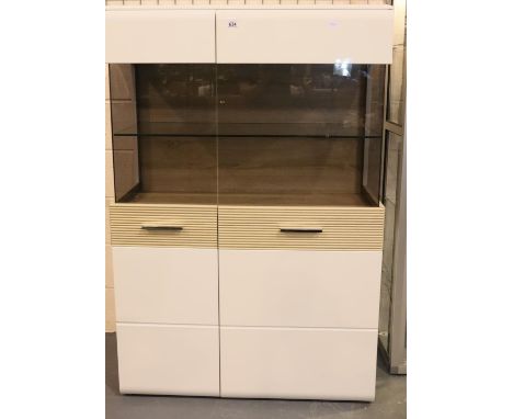 Contemporary illuminated glazed display cabinet with enclosed shelves below, 40 x 100 x 150H cm. Not available for in-house P