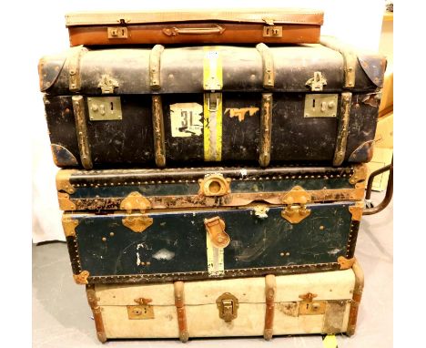 A canvas and wood bound dome top trunk, three steamer trunks and a further travel trunk. Not available for in-house P&amp;P, 
