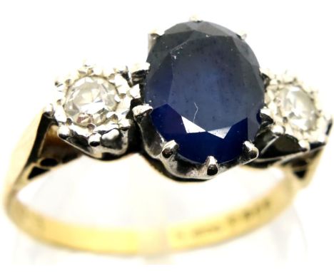 18ct gold sapphire and diamond three stone ring, centre sapphire approximately 1cts, size L/M, 3.7g. P&amp;P Group 1 (£14+VAT