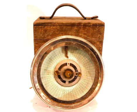 The Automatic Timing Clock Co, an oak cased pigeon clock with key, numbered 210454, D: 18 cm. P&amp;P Group 3 (£25+VAT for th