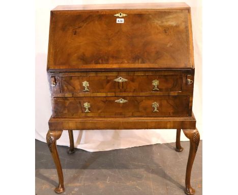 Walnut bureau with fitted interior and two drawers, on cabriole supports, one hinge damaged, 47 x 78 x 107H cm. Not available