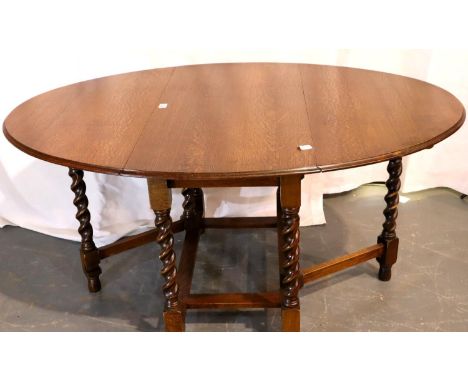 Victorian oval oak drop leaf table on barley twist supports, 106 x 150 cm open. Not available for in-house P&amp;P, contact P