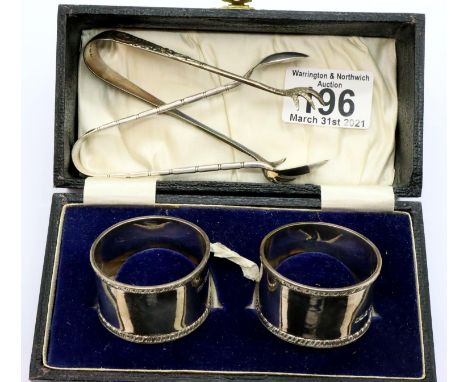 Cased pair of John Dixon and Sons hallmarked silver napkin rings, and two hallmarked silver sugar nips, combined 75g. P&amp;P