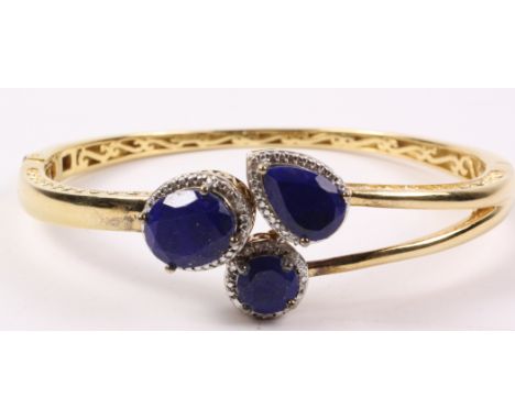 Hinged silver-gilt bangle set with lapis lazuli and diamonds hallmarked Condition Report Click here for further images, condi