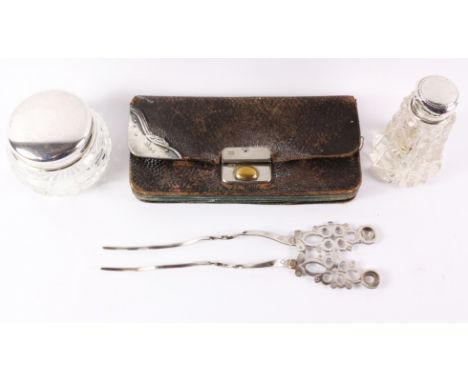 Two dressing table jars with hallmarked silver tops, leather purse with silver mounts and an Italian silver hair comb Conditi