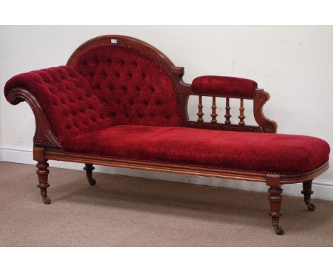 Victorian mahogany chaise longue, upholstered in deep red with button arm and back, with balustrade, raised on baluster turne