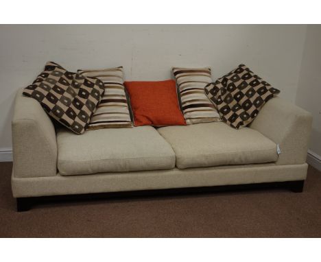 Three seat sofa upholstered in oatmeal fabric with five cushions, on tapered legs, W225