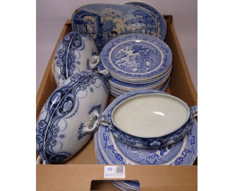 Willow pattern blue and white dinner plates and side plates, two Burslem 'Delhi' tureens, blue and white ceramic drainer and 