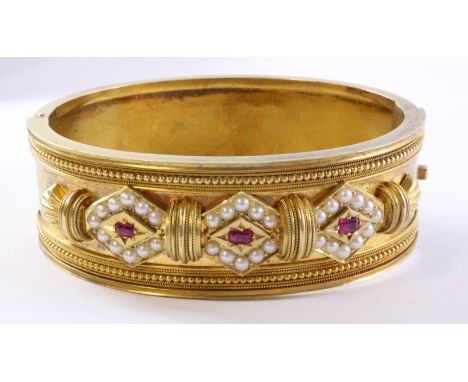 Victorian Etruscan ruby and seed pearl gold hinged bangle tested to 15ct approx 36gm Condition Report Click here for further 