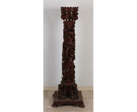 Indonesian wood-carved pedestal with tendrils/birds/fable figures.&nbsp;First half 20th century.&nbsp;Dimensions: 126 x 42 x 