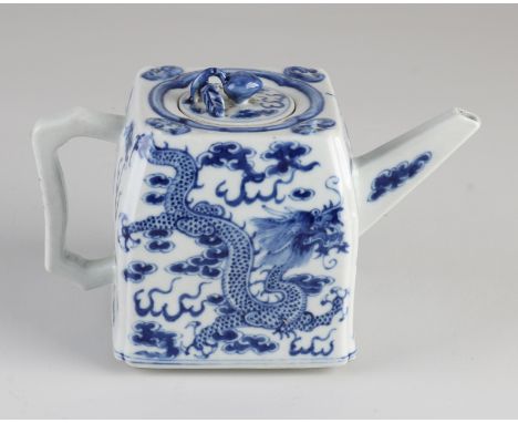 Chinese porcelain teapot with dragons in a cloud decor.&nbsp;Dimensions: 11 x 17 x 8 cm.&nbsp;In good condition.