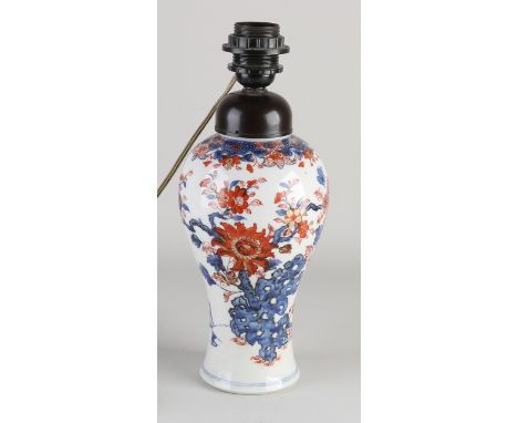 18th century Chinese porcelain vase which has been converted into a table lamp.&nbsp;With bakelite fitting.&nbsp;Hole in bott