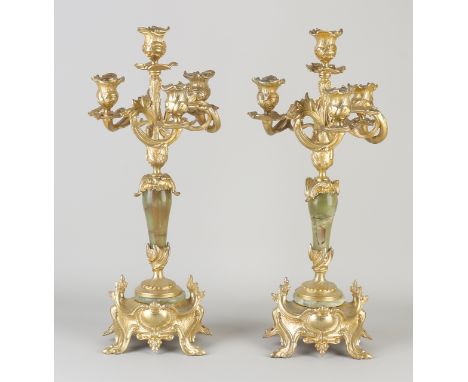 Two gilded Jugendstil candle candlesticks with onyx.&nbsp;4-Light.&nbsp;Circa 1900. Dimensions: H 45 cm.&nbsp;In good conditi