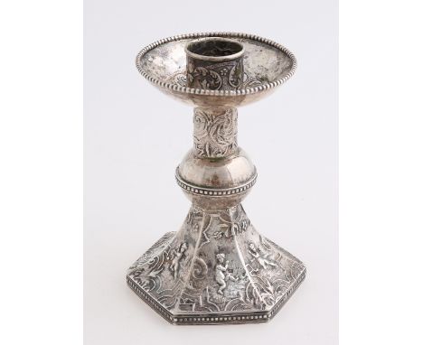 Silver candlestick, 833/000, on a hexagonal base decorated with scenes with putti.&nbsp;Equipped with a round nodus with pear
