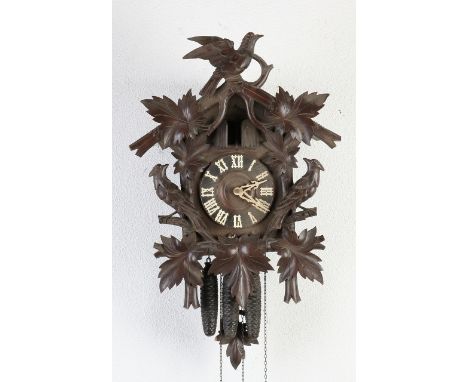 Antique German Black Forest clock with quarter striking and chime.&nbsp;With cylinder and comb + quail.&nbsp;Dimensions: 60 x