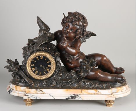 Large French mantel clock with bachus and bird.&nbsp;On marble base.&nbsp;Circa 1890. Composition metal.&nbsp;Eight-day movem
