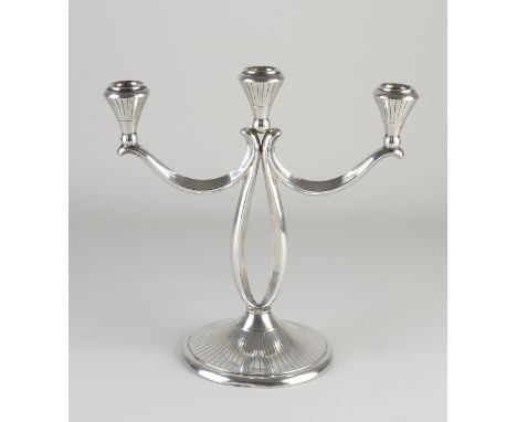 Silver candlestick, 835/000, Art Deco style, round decorated foot with curved arms with lights with a line treatment.&nbsp;26