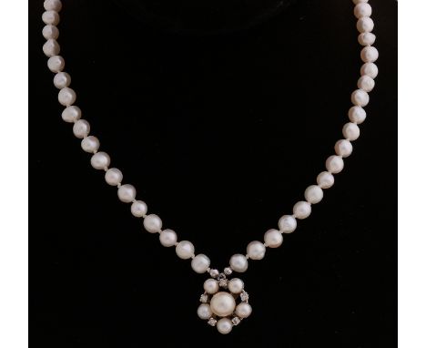 Pearl necklace in the middle with a white gold pendant, 585/000, in rosette shape, ø 15 mm, with 6 cultured pearls and 5 bril