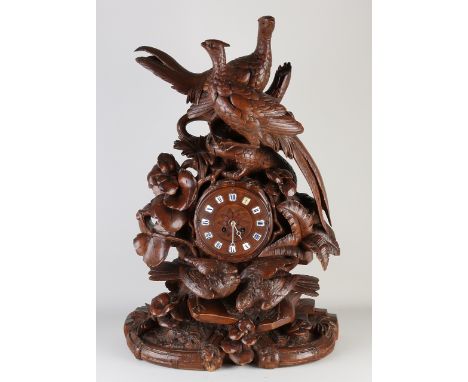 Very large 19th century German Black Forest mantel clock made of walnut.&nbsp;With pheasants/partridges.&nbsp;Eight-day movem