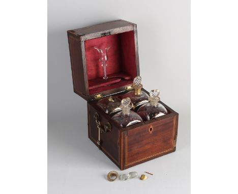 Antique mahogany liqueur cellar with band intarsia.&nbsp;Circa 1800. Slight veneer damage.&nbsp;One decanter damaged, shards 