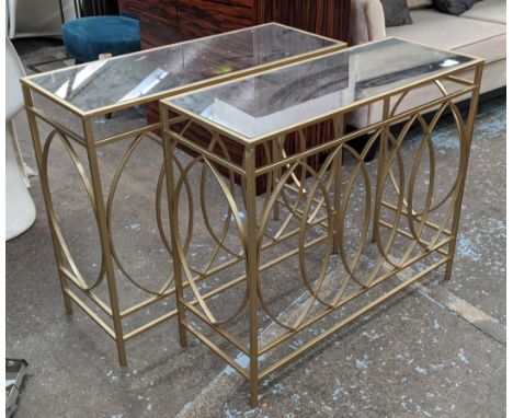 CONSOLE TABLES, a set of two, 90cm x 35cm x 78cm, 1960s French style, gilt metal, mirrored tops. (2) 