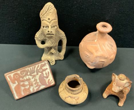 Antiquities  - a Pre Columbian Toltec idol, seated figure;  Mayan stamp seal tablet;  Mask head bottle flask;  Colima dog fla