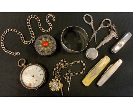 A silver open faced pocket watch;  a silver pill box;  a silver Albert silver backed nail buffer;  chatelaine scissors;  silv