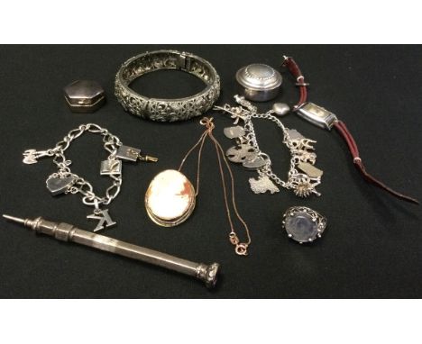 A silver charm bracelet, heart padlock;  another;  a gentleman's silver coin ring;  hinged bangle;  silver pill boxes;  etc 