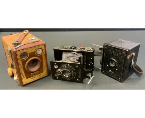 Contessa-Nettel Piccolette strut folding 127 roll film camera, c.1930;  Hwkeye Ace de Luxe 127 camera, c.1940;  Kodak Brownie