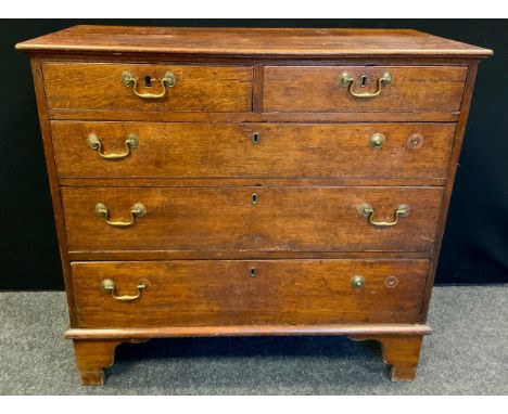A George III oak chest, of two short and three long graduated cockbeaded drawers, swan neck handles, high bracket feet, 86cm 