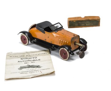 A Structo No 12 Automobile Deluxe,  orange painted steel, crank handle keywind mechanism with gears, windshield, dummy hood a