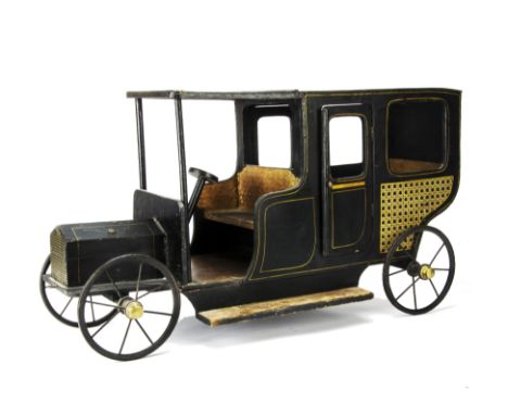 A rare G & J Lines Wooden Doll's Motor Limousine circa 1912,  painted black with yellow lining, transfer paper 'caned' side a