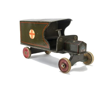 A Swallow Toys Wooden World War One Army Ambulance,  with brass rosettes, wooden wheels and opening back doors --24in. (61cm.