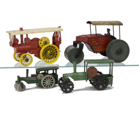 An unusual Tri-ang steel Traction Engine,  painted green with black rubber wheels and wooden fly-wheel --6½in. (16.5cm.) long