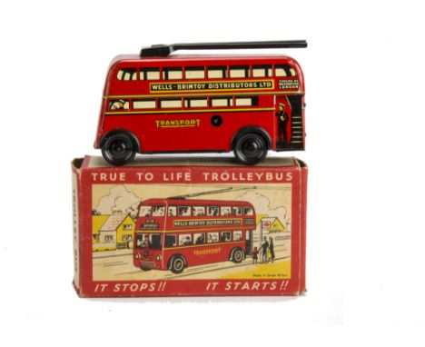 A Wells Brimtoy 9/516 Stop & Go Trolley Bus,  clockwork red lithographed tinplate, black poles and black plastic wheels, in o