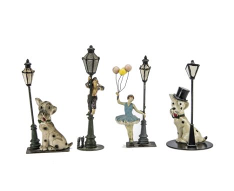 German lead ornaments involving Lamp Posts, two black and white dogs seated beside lamp posts, one in top hat; a ragamuffin c