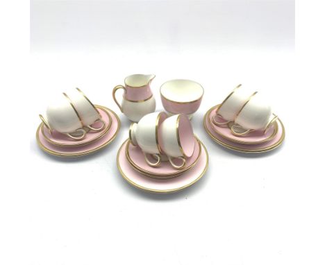  Wedgwood pink, white and gilt decorated part tea service, comprising six cups and saucers, six tea plates, sugar bowl and mi