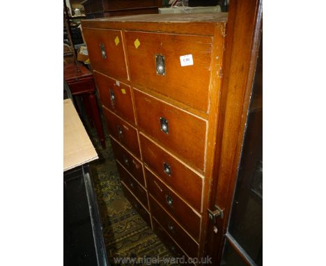 An unusual mid golden Oak Tallboy of twelve short Drawers having chromium plated flush drop ring handles of marine flavour, 2