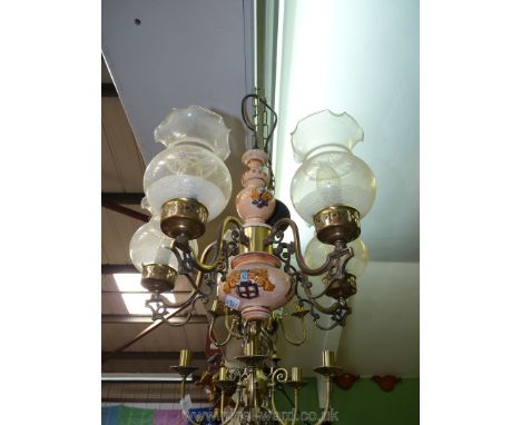 A pottery and ormolu five light electrolier having five glass shades with frosted detail.