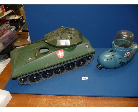 An Action Man tank and Sea Wolf submarine.