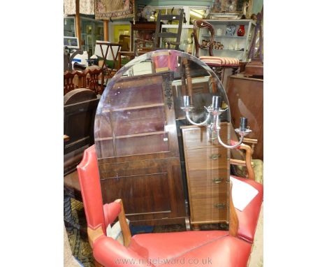 An arched bevelled Mirror having a chromium plated double electric lamp bracket incorporated, 33 1/2'' high x 22 3/4'' wide a