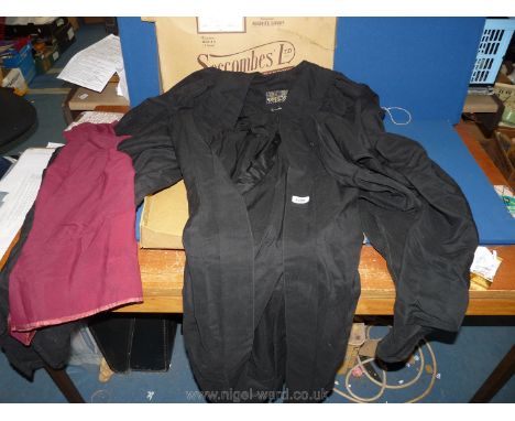 Students black graduation gown by FC Tidman of Bristol, complete with maroon sash in supplier box.