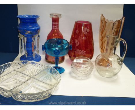 A quantity of glass including blue lamp with droplets, cranberry vase, decanter. etc.