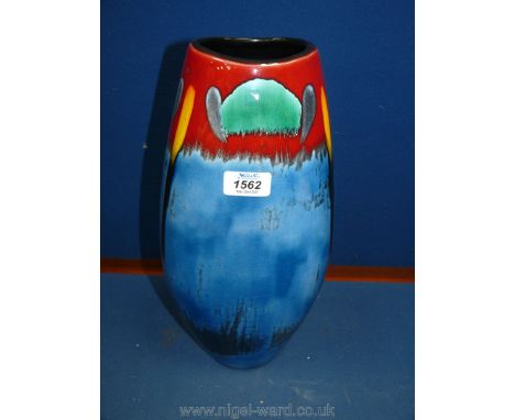 A large Poole Pottery vase in blue, yellow, green and red, 15" tall.