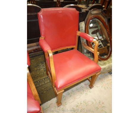 An elegant light Oak framed open armed Elbow Chair standing on tapering square legs, the seats, backs and arms upholstered in