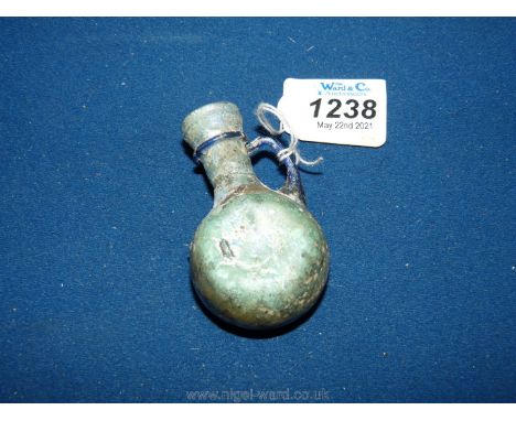 A small and very fragile Roman Glass Flask, showing a very marked degree of iridescence, circa 4th to 5th century A.D, with a