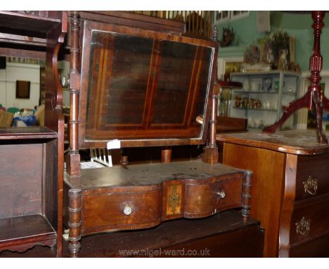 An early 19th c. Mahogany serpentine fronted Swing Mirror, the base with two trinket drawers and a brass inlaid central featu