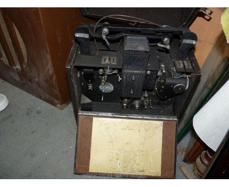 A vintage sound/silent cine projector model L516 by GB Equipment Ltd, integral case together with large GB Equipment wooden c